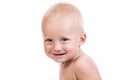 Portrait of a smiling nine-month old boy on white