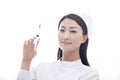 Portrait of Smiling Nurse Holding a Syringe and Looking At Camera Royalty Free Stock Photo