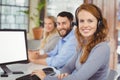 Portrait of smiling operators working in office Royalty Free Stock Photo