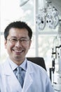 Portrait of smiling optometrist in his clinic