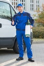 Pest Control Worker Showing Thumbsup By Truck