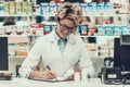 Portrait Smiling Pharmacist Working in Drugstore Royalty Free Stock Photo