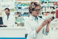 Portrait Smiling Pharmacist Working in Drugstore Royalty Free Stock Photo