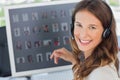 Portrait of a smiling photo editor wearing a headset