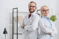 portrait of smiling physiotherapists in white coats looking at camera Royalty Free Stock Photo