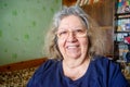 Portrait of a Smiling Positive Jewish Elderly Lady at her Home