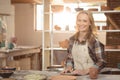 Smiling potters working together in pottery workshop Royalty Free Stock Photo