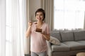 Portrait of smiling pregnant woman eating chocolate cake at home Royalty Free Stock Photo