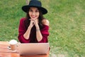 Portrait of a smiling pretty asian girl using laptop computer Royalty Free Stock Photo