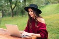 Portrait of a smiling pretty asian girl using laptop computer Royalty Free Stock Photo