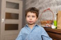 Portrait of a smiling, pretty boy of several years in the children room.