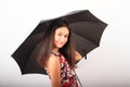 Portrait of smiling pretty girl under black umbrella Royalty Free Stock Photo