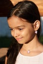 Portrait of a smiling pretty little girl, close-up, outdoors Royalty Free Stock Photo