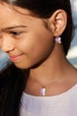 Portrait of a smiling pretty little girl, close-up, outdoors Royalty Free Stock Photo