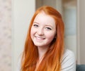 Portrait of smiling red-haired tenager