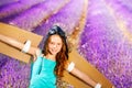 Cute girl in pilot costume against lavender field