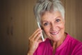 Portrait of a smiling retired woman making a call