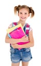 Portrait of smiling school girl child with school bag and books Royalty Free Stock Photo