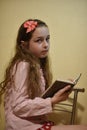 Portrait of a smiling schoolgirl 10 years old with abackpack, notebooks. 10 years old girl with a notebook