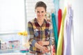 Portrait of smiling seamstress in studio Royalty Free Stock Photo