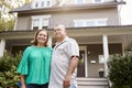 Portrait Of Smiling Senior Couple In Front Of Their Home Royalty Free Stock Photo