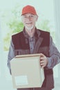 Portrait of smiling senior deliverer