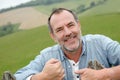 Portrait of smiling senior farmer in the fields