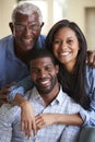 Portrait Of Smiling Senior Father With Adult Son And Daughter Hugging At Home Royalty Free Stock Photo