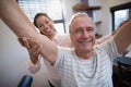 Portrait of smiling senior male patient and female doctor with arms raised Royalty Free Stock Photo