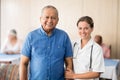 Portrait of smiling senior male patient with female doctor Royalty Free Stock Photo
