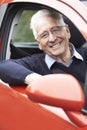 Portrait Of Smiling Senior Man Driving Car Royalty Free Stock Photo