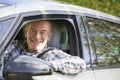 Portrait Of Smiling Senior Man Driving Car Royalty Free Stock Photo