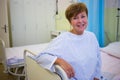 Portrait of smiling senior patient sitting on a bed Royalty Free Stock Photo