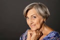 Portrait of smiling senior woman posing in studio Royalty Free Stock Photo