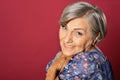 Portrait of smiling senior woman posing in studio Royalty Free Stock Photo