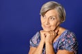 Portrait of smiling senior woman posing in studio Royalty Free Stock Photo