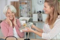 portrait smiling senior woman receiving present Royalty Free Stock Photo