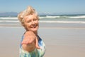Portrait of smiling senior woman standing against clear sky Royalty Free Stock Photo