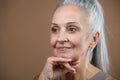 Portrait of smiling senior woman in studio. Royalty Free Stock Photo