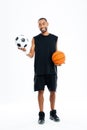 Portrait of a smiling sports man looking at soccer ball Royalty Free Stock Photo