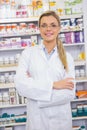 Portrait of a smiling student in lab coat with arms crossed Royalty Free Stock Photo