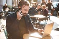 Portrait of a smiling stylish man working on laptop Royalty Free Stock Photo