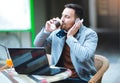 Portrait of a smiling stylish man working on laptop computer Royalty Free Stock Photo