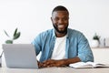 Portrait Of Smiling Successful African American Entrepreneur Posing At Workplace In Office Royalty Free Stock Photo