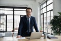 Portrait of smiling successful businessman posing at workplace Royalty Free Stock Photo