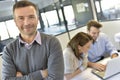 Portrait of a smiling and successful businessman with a workteam Royalty Free Stock Photo