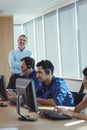 Portrait of smiling supervisor with business team at call center Royalty Free Stock Photo