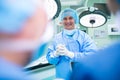 Portrait of smiling surgeons standing in operation room Royalty Free Stock Photo