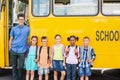 Portrait of smiling teacher and kids standing together Royalty Free Stock Photo