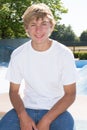 Smiling teen boy outdoors looking at camera with handsome smile on face Royalty Free Stock Photo